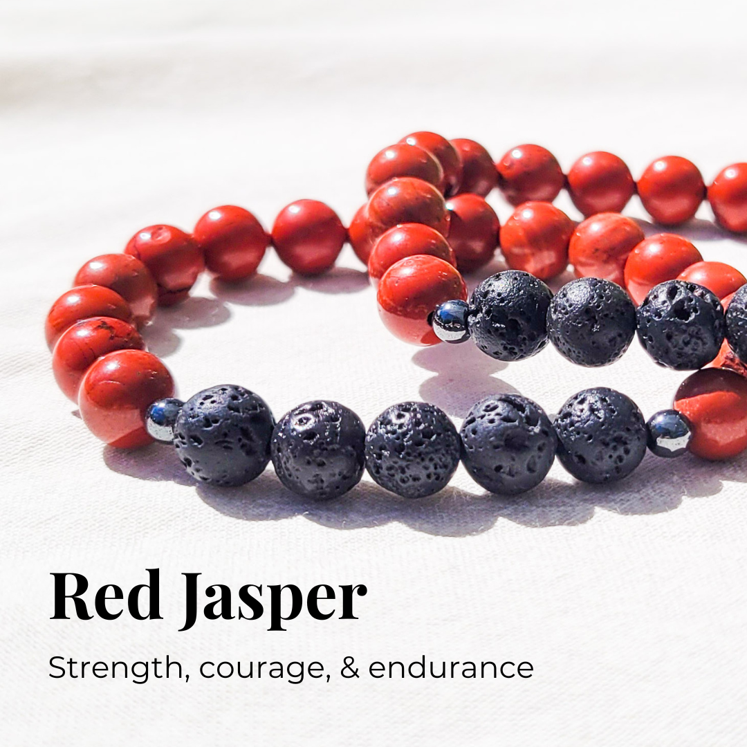 Red jasper diffuser bracelet with black lava stones and silver hematite spacers for essential oil diffusion.