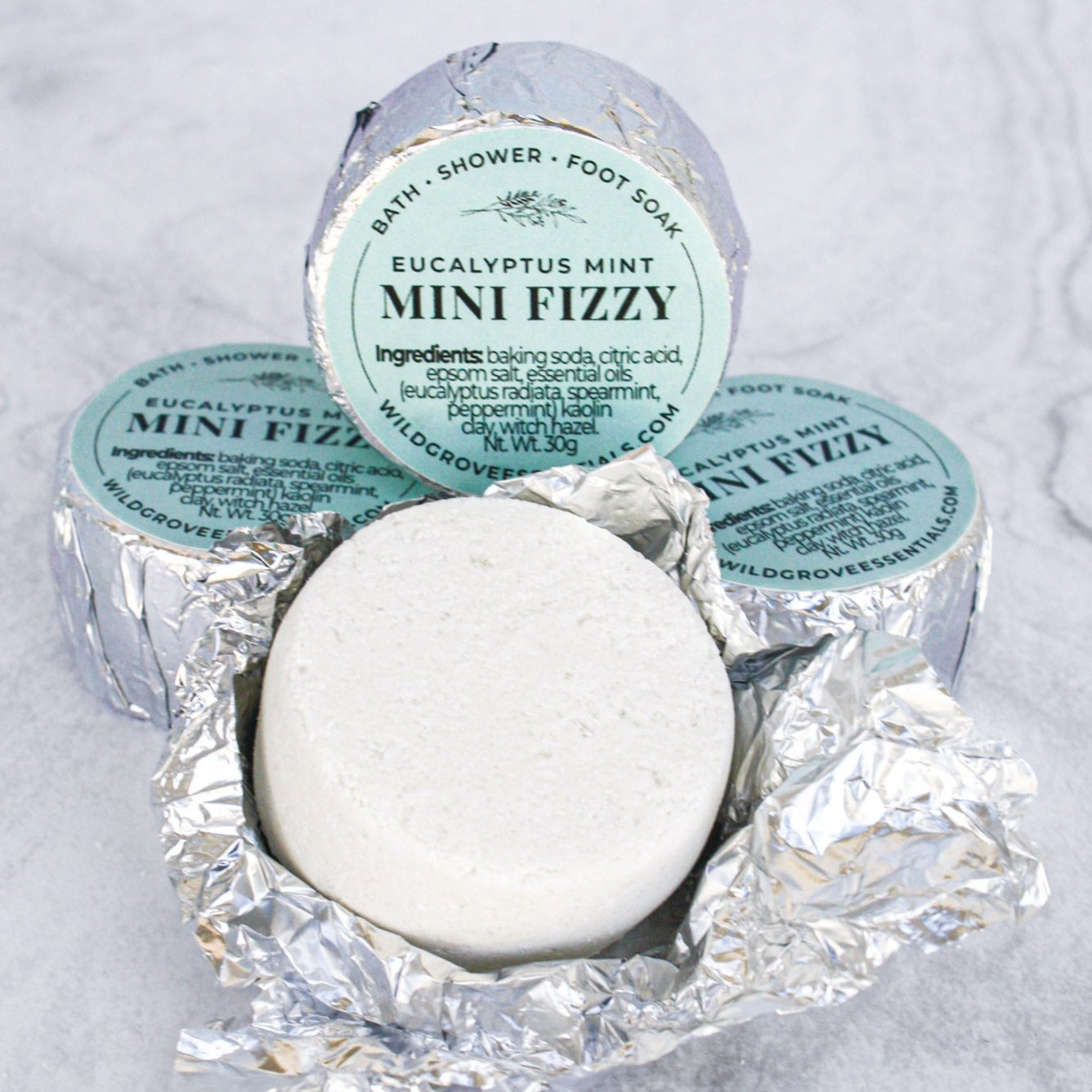 Mini Bath and Shower fizzies in Eucalyptus Mint scent wrapped in foil with a blue label. 