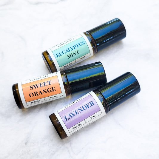 Mini essential oil roll-on bottles in small 5ml bottles in Eucalyptus Mint, Sweet Orange, and Lavender scents. 